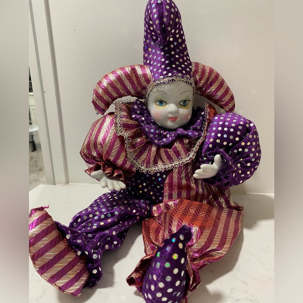 Vintage Harlequin Jester doll with porcelain face and hands